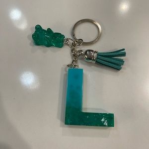 Handmade greenish blue resin L keychain with resin gummy bear and tassel